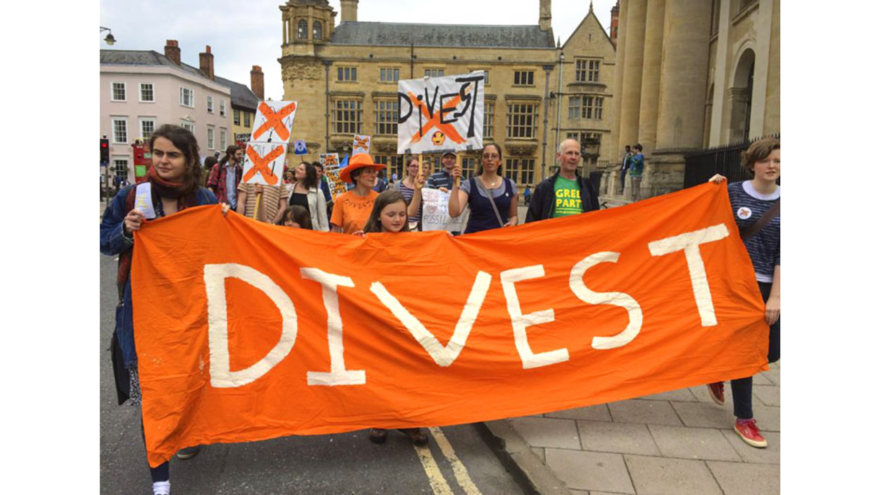 Protestors with Divest Banner